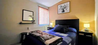 Cama o camas de una habitación en Pintoresca y Acogedora Casita Pueblo Mágico
