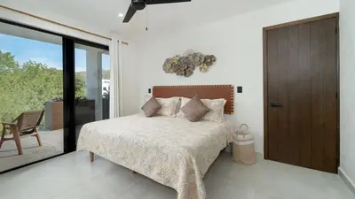 Cama o camas de una habitación en Ziba Condos Departamento con terraza