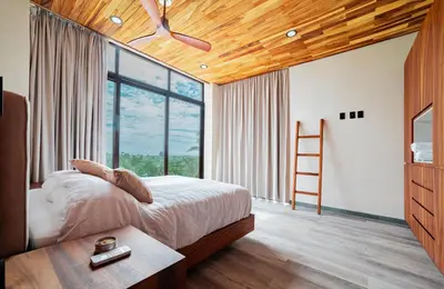 Cama o camas de una habitación en Residencial Pacific Palmarito Oaxaca