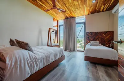 Cama o camas de una habitación en Residencial Pacific Palmarito Oaxaca