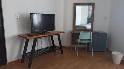 Una televisión o centro de entretenimiento en Casa Terraza Oaxaca