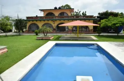 Piscina en o cerca de Alberca y jardín Palmeras