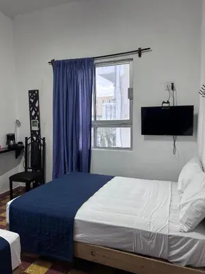Cama o camas de una habitación en Hotel puerta de mar