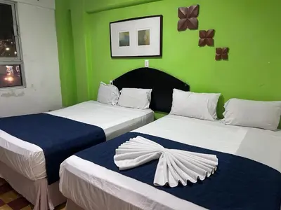 Cama o camas de una habitación en Hotel puerta de mar