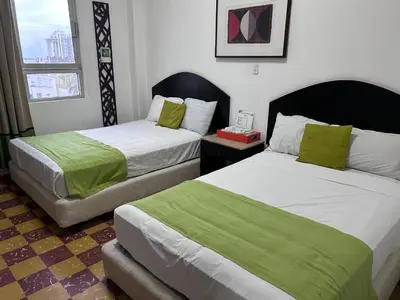 Cama o camas de una habitación en Hotel puerta de mar