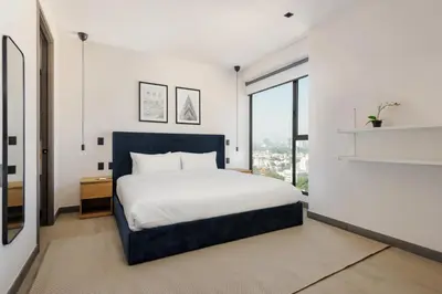 Cama o camas de una habitación en Modern Living in Be Grand del Valle