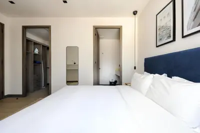 Cama o camas de una habitación en Modern Living in Be Grand del Valle