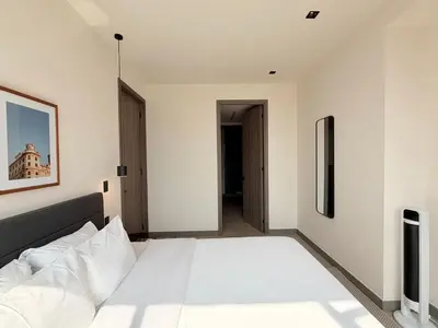 Cama o camas de una habitación en Modern Living in Be Grand del Valle