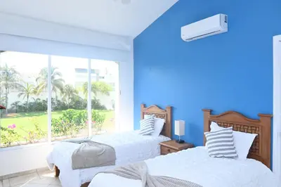 Cama o camas de una habitación en Villas Zamma Acapulco