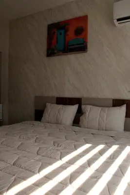 Cama o camas de una habitación en Puerta Paraíso Tranquilidad cerca del aeropuerto