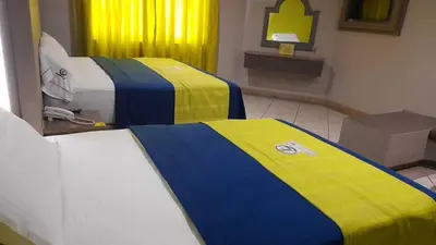 Cama o camas de una habitación en Autohotel Punto de Descanso Cordoba