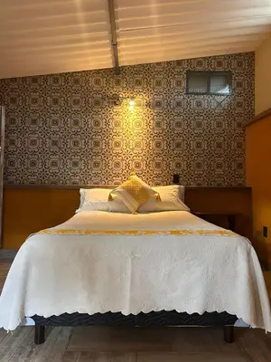 Cama o camas de una habitación en El Bungalow de Juana