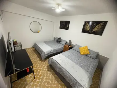 Cama o camas de una habitación en Departamento céntrico y cómodo La Casona