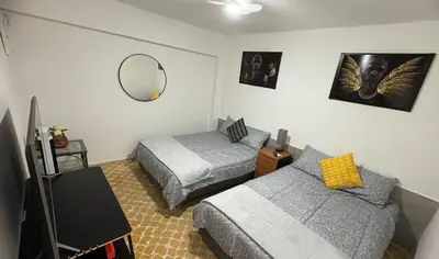 Cama o camas de una habitación en Departamento céntrico y cómodo La Casona