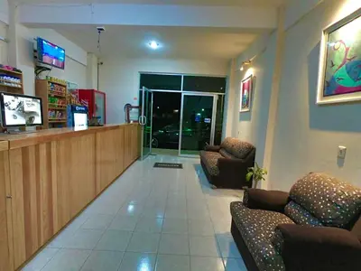 Una televisión o centro de entretenimiento en Hotel MERLI