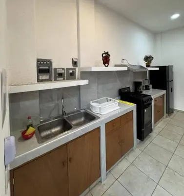 Una cocina o zona de cocina en La Perla residencia completa 3 habitaciones