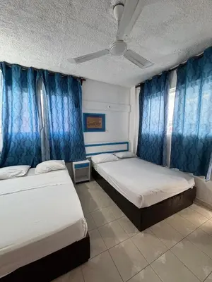 Cama o camas de una habitación en Acapulco LUUM hotel