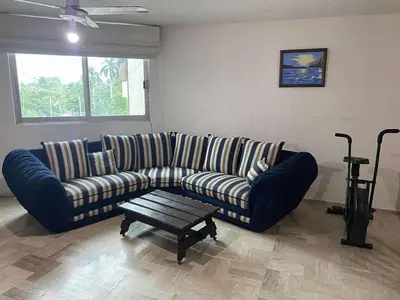 Zona de estar de Cómodo Departamento