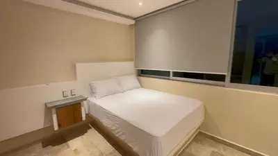Cama o camas de una habitación en Condo hotel en playa Bonfil a 300 m de la playa