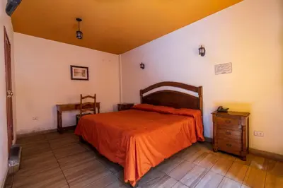 Cama o camas de una habitación en Mesón Real Hotel & Suites