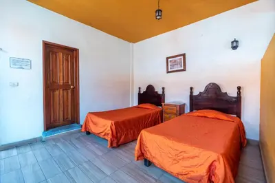 Cama o camas de una habitación en Mesón Real Hotel & Suites