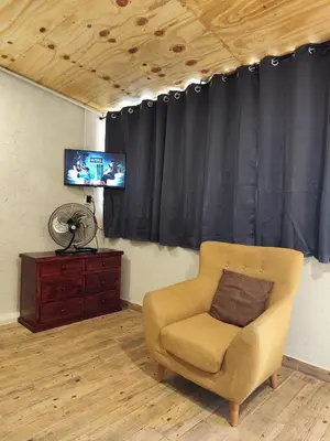 Una televisión o centro de entretenimiento en LOFT 2 PAX en Matías Romero, moderno y cómodo