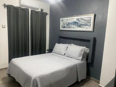 Cama o camas de una habitación en Departamento 5 Céntrico con WiFi y estacionamiento