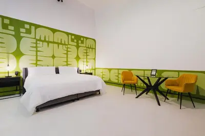 Cama o camas de una habitación en Cocoon Oaxaca City- Curated Stay In Oaxaca Centro