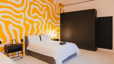 Cama o camas de una habitación en Cocoon Oaxaca City- Curated Stay In Oaxaca Centro