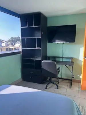 Una televisión o centro de entretenimiento en Habitacion uno