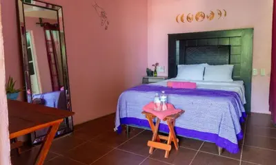 Cama o camas de una habitación en POSADA CENTRO MAZUNTE RINCONCITo