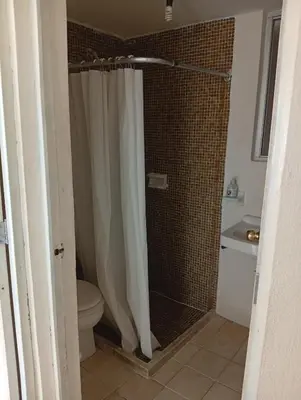 Un baño de Two-bedroom condo Ground floor