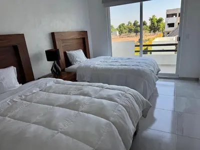 Cama o camas de una habitación en Villa Arlequín 1