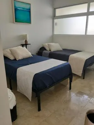Cama o camas de una habitación en Depa frente al mar en acapulco costera con alberca