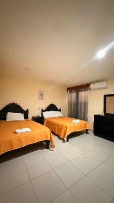 Cama o camas de una habitación en Hotel Boutique Los Laureles