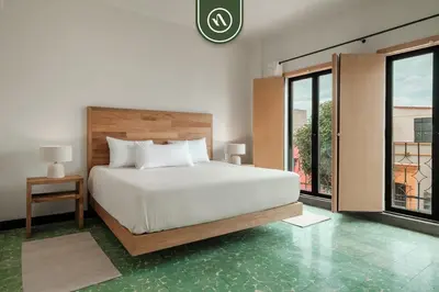 Cama o camas de una habitación en Centric 3BR Condo in Downtown in Oaxaca