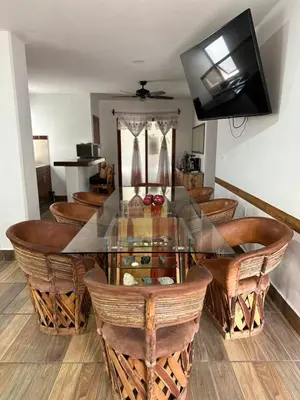 Una televisión o centro de entretenimiento en The Coast Condo- Huatulco