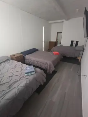 Cama o camas de una habitación en SamBella Azteca Stay
