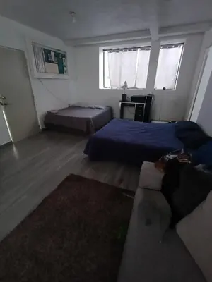 Cama o camas de una habitación en SamBella Azteca Stay
