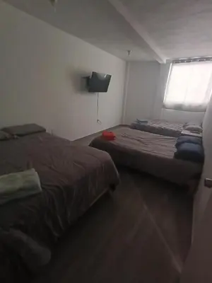 Cama o camas de una habitación en SamBella Azteca Stay