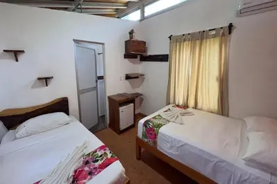 Cama o camas de una habitación en Hotel Frida Paradise
