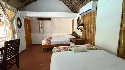 Cama o camas de una habitación en Hotel Frida Paradise