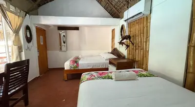 Cama o camas de una habitación en Hotel Frida Paradise