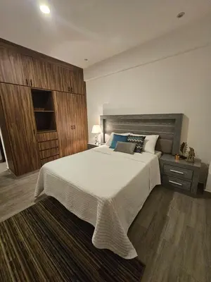 Cama o camas de una habitación en Lujoso departamento a una cuadra de la playa