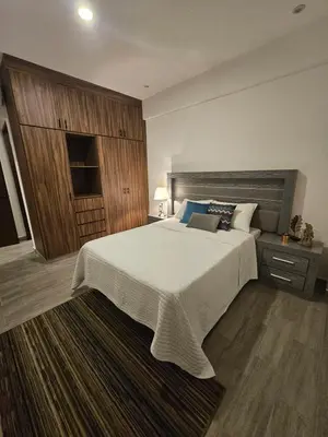 Cama o camas de una habitación en Lujoso departamento a una cuadra de la playa