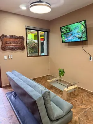 Una televisión o centro de entretenimiento en Casa Zapata
