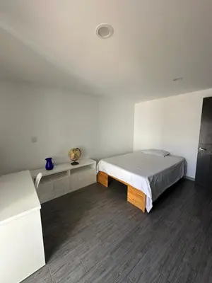 Cama o camas de una habitación en Suite Ejecutiva FINSA con Baño Privado y Parking