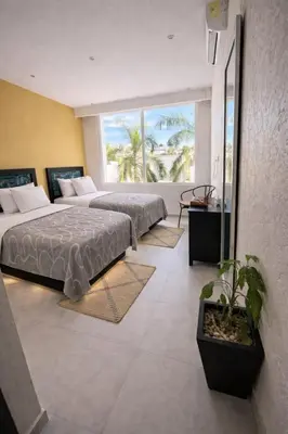 Cama o camas de una habitación en Villa en Acapulco Diamante