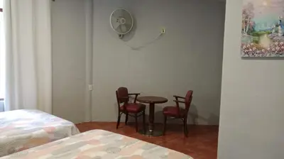 Cama o camas de una habitación en Quinta Corona Hospedaje Familiar