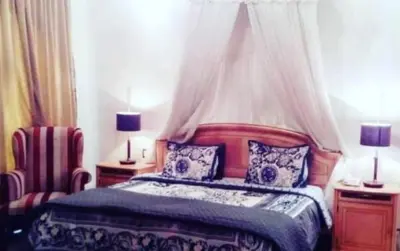 Cama o camas de una habitación en Hotel Real Casa Gloria